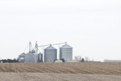 These is a grain storage faciltiy at the end of winter waiting for spring planting and fall harvest to occur.